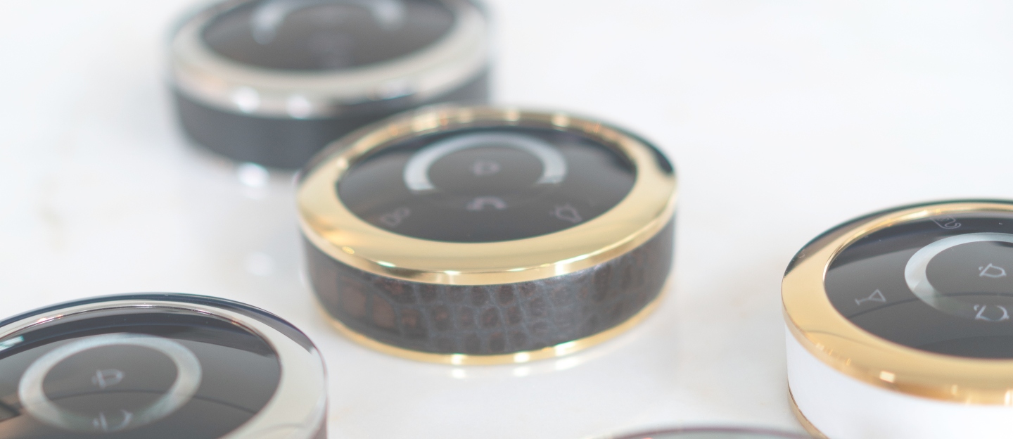 GEST buttons gold and silver rings on a table